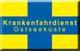 Gelbes Kreuz auf blauem Grund mit Schrift: "Krankenfahrdienst Ostseeküste".