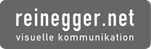 Logo mit der Aufschrift "reinegger.net visuelle kommunikation" auf grauem Hintergrund.