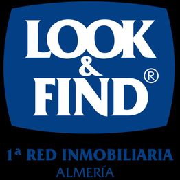 Logo de "Look & Find", 1ª red inmobiliaria, texto en azul sobre fondo blanco, Almería.