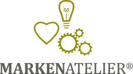 Logo mit Herz, Glühbirne, Zahnrädern und dem Text "MARKENATELIER".