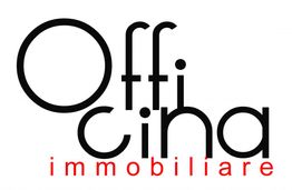 Logo con la scritta nera "Officina" e rossa "immobiliare" su sfondo bianco.