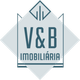 Logo da V&B Imobiliária em um design geométrico azul sobre fundo claro.