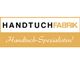 Logo der Handtuchfabrik mit dem Schriftzug „Handtuch-Spezialisten“ auf gelbem Hintergrund.