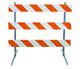 Traffic barricade with orange and white diagonal stripes on three horizontal panels.