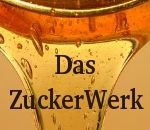 Goldener Honigtropfen mit schwarzer Aufschrift: "Das ZuckerWerk".