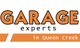 Logo reading "Garage Experts in Queen Creek" with orange and black text.