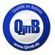 Logo: Blauer Kreis mit weißem Zentrum, Text "Qualität im Betrieb" und "www.QimB.de".