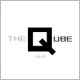 Logo mit großem schwarzen Q in der Mitte, daneben der Text "THE QUBE" in Schwarz und Grau.