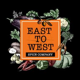 Orange "East to West Spice Company" logo surrounded by colorful vegetable illustrations.