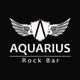 Logo do Aquarius Rock Bar com asas estilizadas em fundo preto.