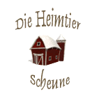 Rote Scheune mit Aufschrift „Die Heimtier Scheune“.