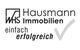 WHS Hausmann Immobilien Logo, Text: "einfach erfolgreich" mit grauem Haken.