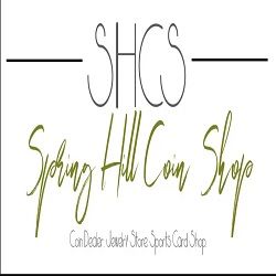 "Logo for Spring Hill Coin Shop, featuring text in cursive and a description of shop offerings."