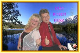Zwei Personen posieren lächelnd vor einem Bergsee, mit Text "Duo Rosen Herz" und Notensymbol.