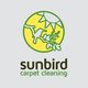 Logo of Sunbird Carpet Cleaning with a bird on a branch and the sun in the background.