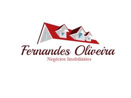 Logotipo da Fernandes Oliveira Negócios Imobiliários com desenho de telhados vermelhos.