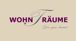 Schriftzug "WOHN TRÄUME" mit Slogan "Live your dream!" auf beigem Hintergrund.