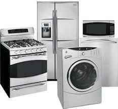 Kitchen appliances: stove, fridge, microwave, and washer in silver and white tones.