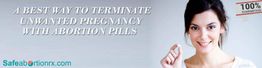 Smiling woman holding a pill with text: "A best way to terminate unwanted pregnancy with abortion pills."