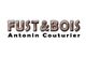Texte : "Fust & Bois Antonin Couturier" en bois et noir.