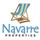 Navarre Properties logo with a blue and yellow striped beach chair illustration.
