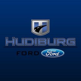 Hudiburg Ford logo with a blue shield and road graphic on a dark blue background.