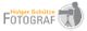 Logo mit Schriftzug "Holger Schütze Fotograf", daneben Silhouette mit Kamera auf Stativ.
