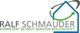 Logo mit Hausumriss, Pfeilen und Text: "RALF SCHMAUDER - Kompetent betreut beraten begutachtet".