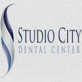 Logo of Studio City Dental Center with a blue and white swirl design on the left.