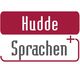 Rotes und weißes Logo mit der Aufschrift "Hudde Sprachen+".