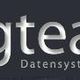 Logo der Firma "orgteam Datensysteme GmbH" auf dunkelgrauem Hintergrund.