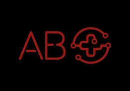 Texto "AB" en rojo junto a un diseño circular con un símbolo de cruz, sobre fondo negro.