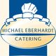 Catering-Logo: "Michael Eberhardt Catering" mit Kochmütze und blauem Hintergrund.