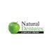 Logo of Natural Dentures & Implant Center featuring a green apple on the left.
