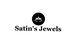 Logo of Satin's Jewels with a lotus design in a black circle.