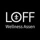 LOFF Wellness Assen logo met een witte lelie in de letter O op zwarte achtergrond.
