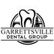 Logo of Garrettsville Dental Group with a tooth and building silhouette in black and white.