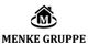 Logo der Menke Gruppe: Ein Haus mit dem Buchstaben "M" und der Text "MENKE GRUPPE" darunter.