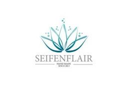 Logo mit blauer Blume, Text "Seifenflair", "Hand Made since 2023".