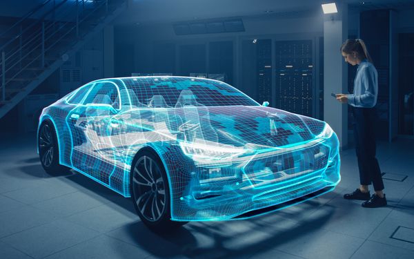 Ingenieurin verwendet Tablet um ein Software-Defined Vehicle mit aktuellen Softwares zu versorgen.