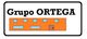Texto "Grupo ORTEGA" sobre un edificio naranja con ventanas y puerta marrón.