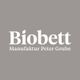 Grau-weißer Schriftzug: "Biobett Manufaktur Peter Grube" auf grauem Hintergrund.
