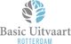 Logo van Basic Uitvaart Rotterdam met een gestileerde boom in grijs en blauw.