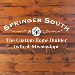 "Springer South logo on wood; reads 'The Custom Home Builder, Oxford, Mississippi.'"