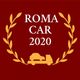 Logo "Roma Car 2020": corona d'alloro gialla, auto su camioncino, fondo rosso.
