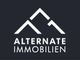 Logo mit zwei Bergen und Text "ALTERNATE IMMOBILIEN" auf schwarzem Hintergrund.