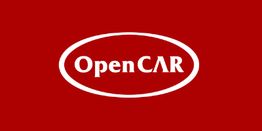 Logo de OpenCAR en fondo rojo con letras blancas dentro de un óvalo blanco.