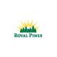 Logo of Royal Pines with sun rays and pine trees above the text.