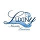 Luxiny logo with leaf and flowing wave design and the text "Naturally Luxurious."
