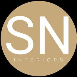 "SN Interiors logo in white text on a beige circular background."